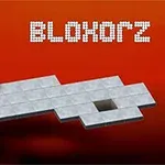 Jeu de puzzle Blokorz avec un bloc métallique et plateforme en forme de T sur fond rouge