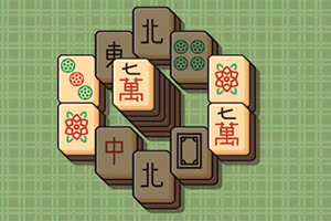 Tuiles de Mahjong disposées sur un fond quadrillé vert