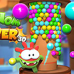 Tour de jeu Nom Nom Tower 3D avec un personnage de dessin animé vert et des boules colorées