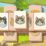 Jeu de mémoire avec des cartes de chats dessinés sur un fond de paysage naturel