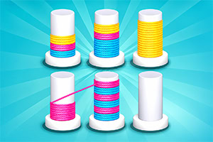 Six bobines blanches de fil coloré, dont certaines en cours d’enroulement, sur fond turquoise à motifs rayonnants